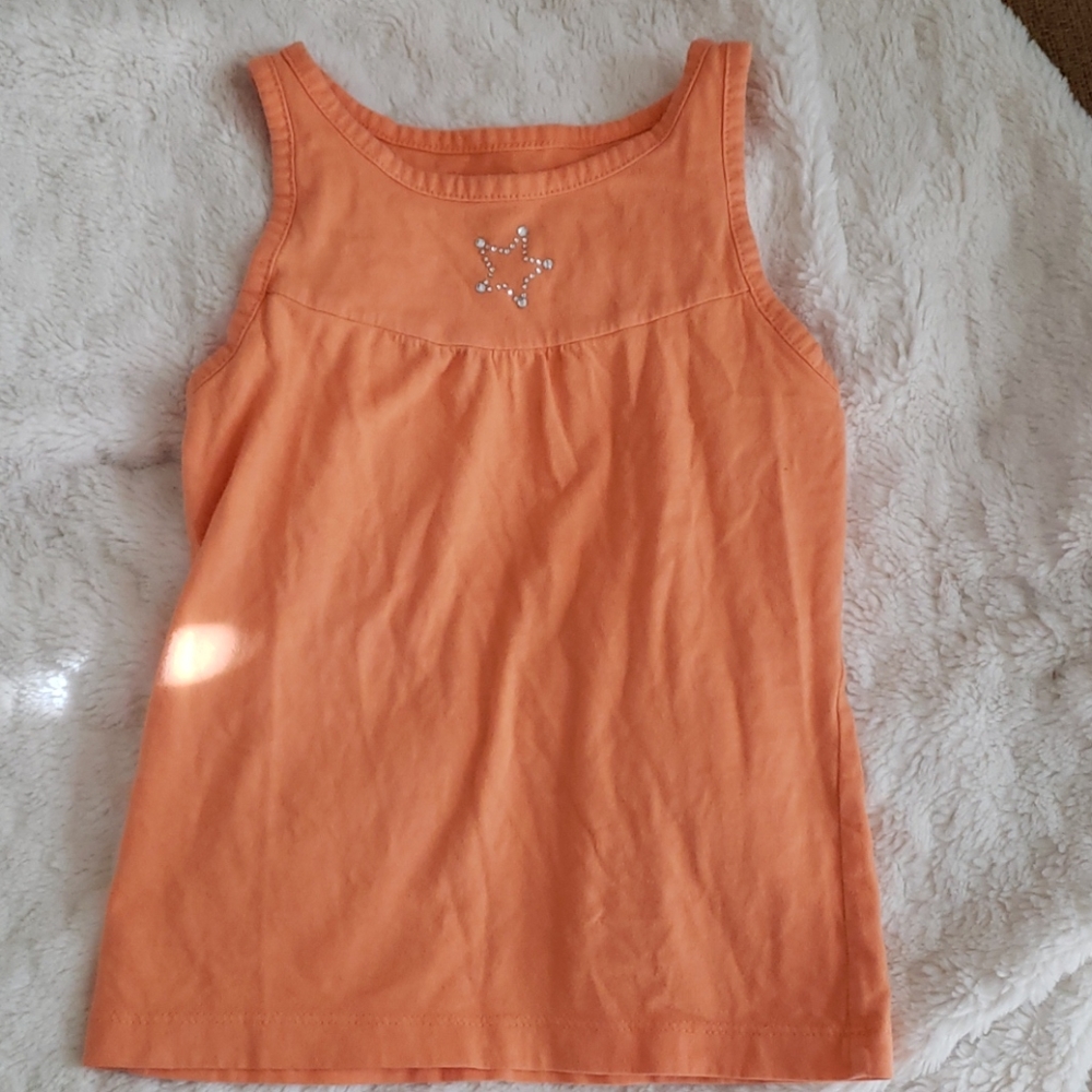 Circo is small orange jeweled top